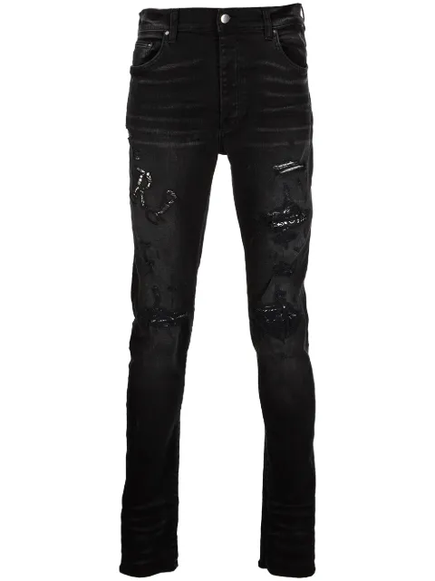 AMIRI jeans slim con efecto envejecido