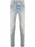 AMIRI logo-patch stonewashed skinny jeans - Blue
