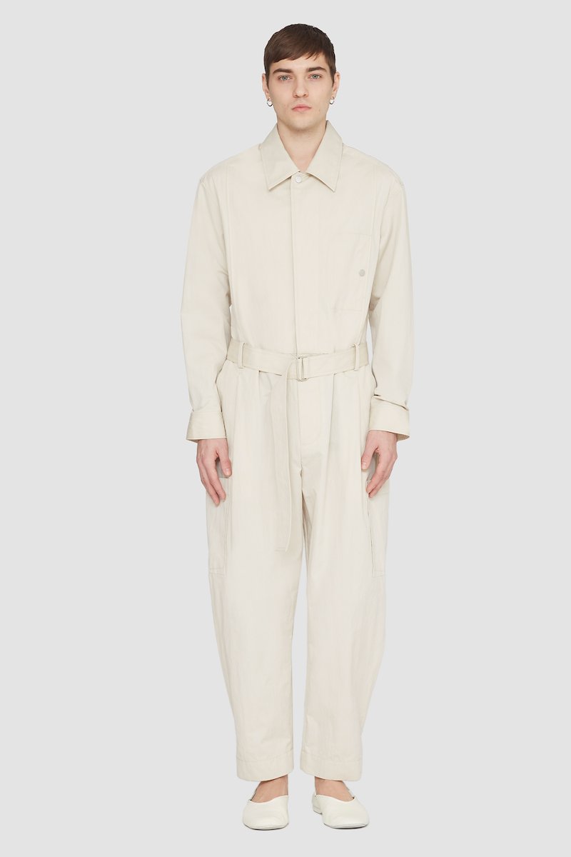 Relaxed Jumpsuit-neutrals #1 Relaxed Jumpsuit, long-sleeve jumpsuit from 3.1 PHILLIP LIM featuring sand beige, cotton blend, concealed front fastening, button-fastening chest pocket, belted waist, two side slit pockets, two side patch pockets, straight leg, classic collar and long sleeves.- 1