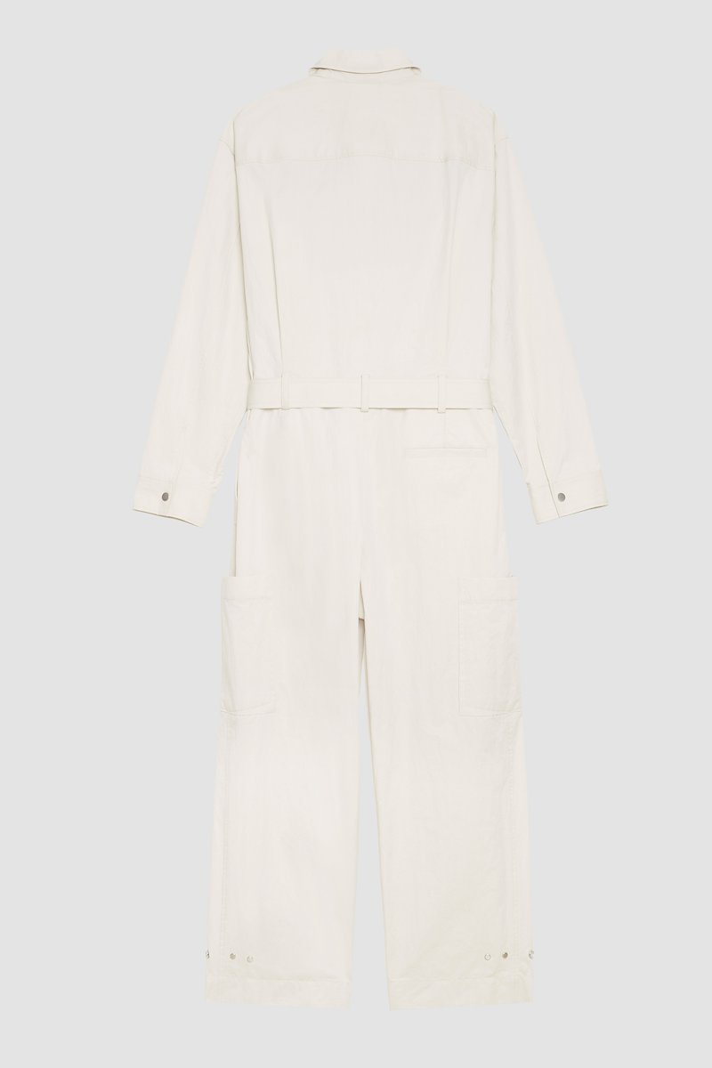 Relaxed Jumpsuit-neutrals #0 Relaxed Jumpsuit, long-sleeve jumpsuit from 3.1 PHILLIP LIM featuring sand beige, cotton blend, concealed front fastening, button-fastening chest pocket, belted waist, two side slit pockets, two side patch pockets, straight leg, classic collar and long sleeves.- 6
