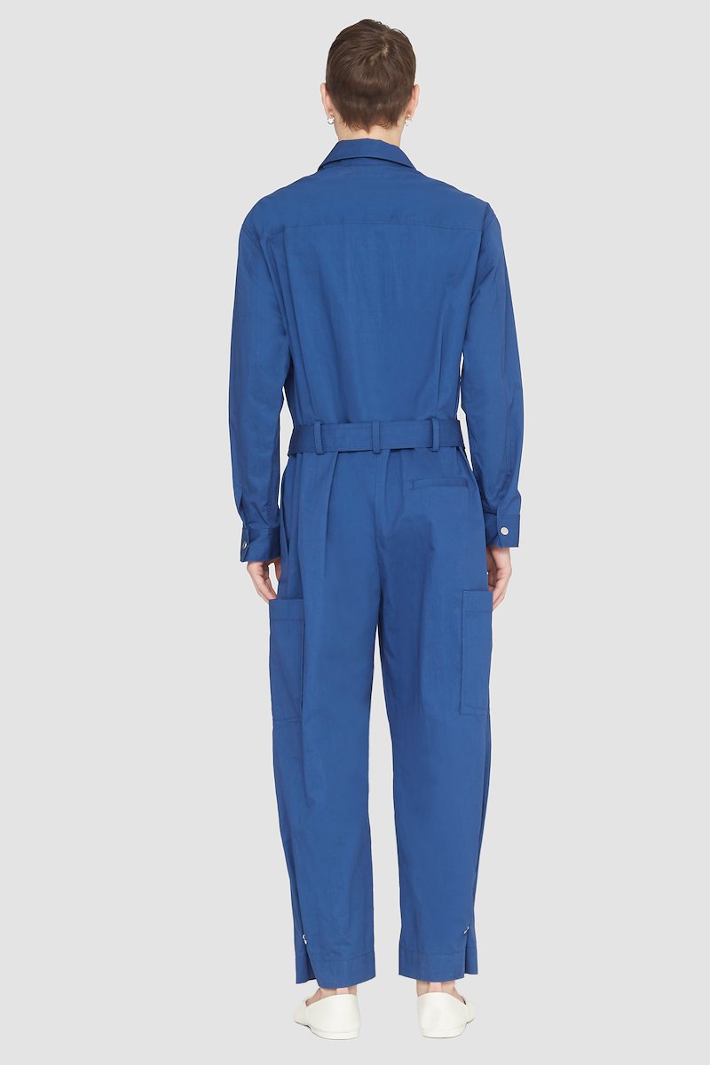 Relaxed Jumpsuit-blue #1 Relaxed Jumpsuit, long-sleeve jumpsuit from 3.1 PHILLIP LIM featuring blue, cotton blend, concealed front fastening, button-fastening chest pocket, belted waist, two side slit pockets, two side patch pockets, straight leg, classic collar and long sleeves.- 3