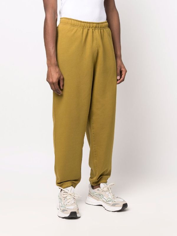 nike swoosh yellow joggers