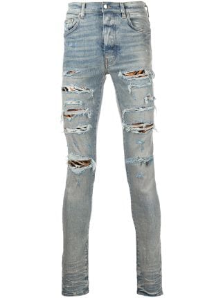 AMIRI MX1 Distressed Skinny Jeans - Farfetch