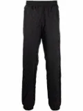 MISBHV logo-monogram tapered joggers - Black