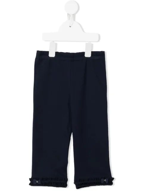 familiar ruffle-trimmed trousers