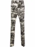 AMIRI graphic-print flared trousers - Neutrals
