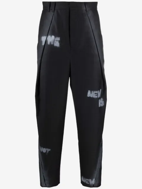 Ader Error pantalones rectos con eslogan