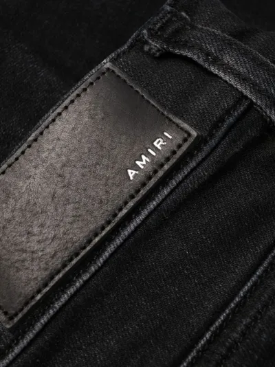 ripped skinny-fit jeans | AMIRI 