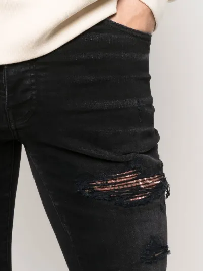 ripped skinny-fit jeans | AMIRI 