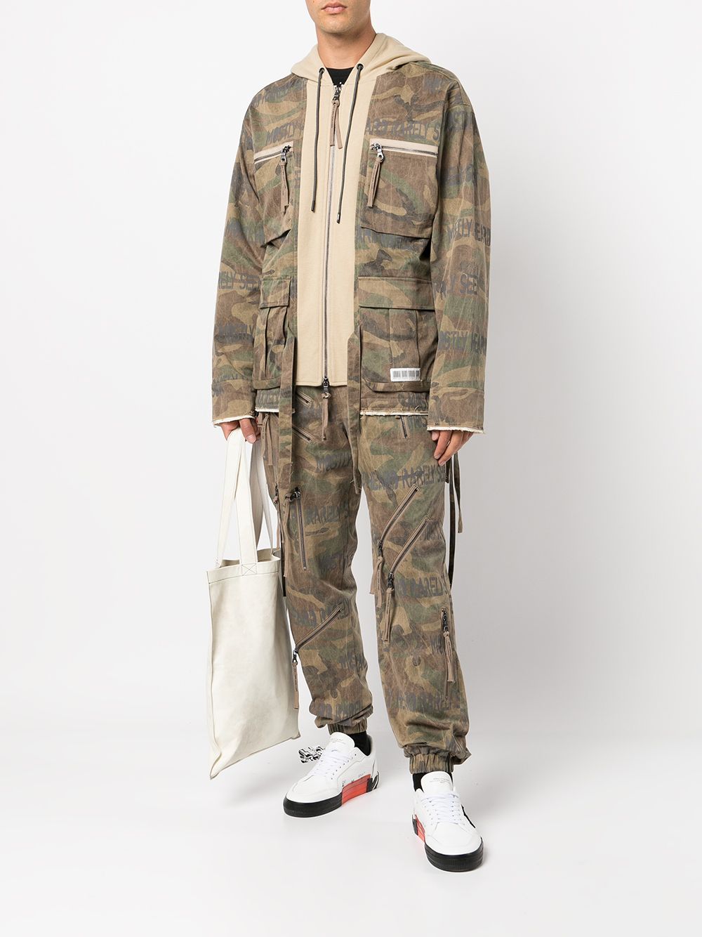 Shop Mostly Heard Rarely Seen Camouflage Zip-detail Trousers In Brown