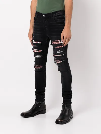 ripped skinny jeans | AMIRI | Eraldo.com