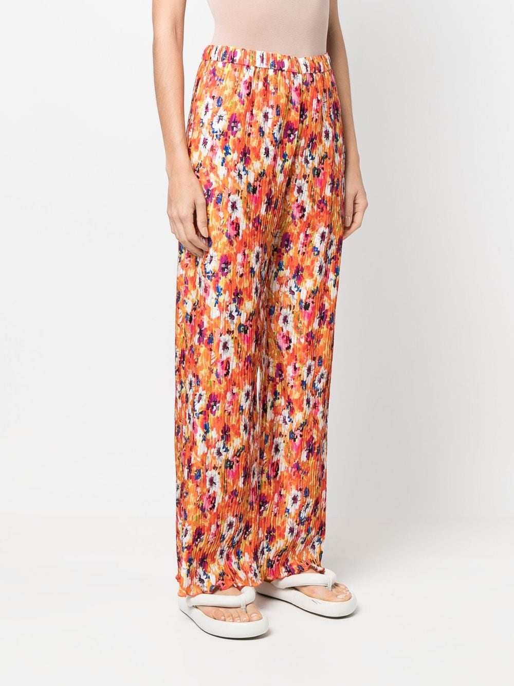Shop Msgm Pleated Floral-print Trousers In Orange