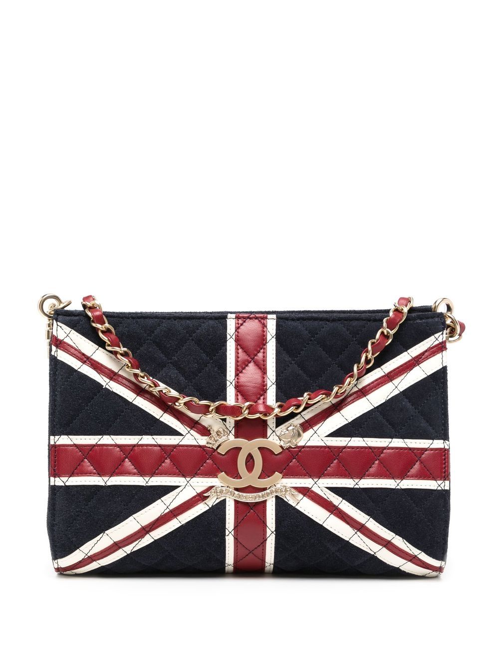 London, UK. 11 March 2022. A staff member presents a Chanel Union Jack  shoulder bag (Est. £2,000 – 3,000) alongside designer handbags at a preview  of Bonhams upcoming Designer Handbags and Fashion