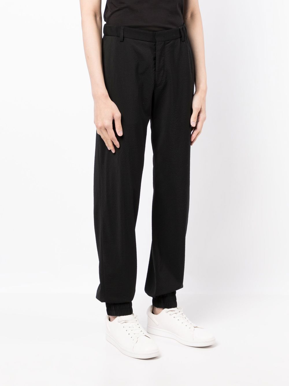 Shop Emporio Armani Cuffed Virgin Wool Trousers In Schwarz