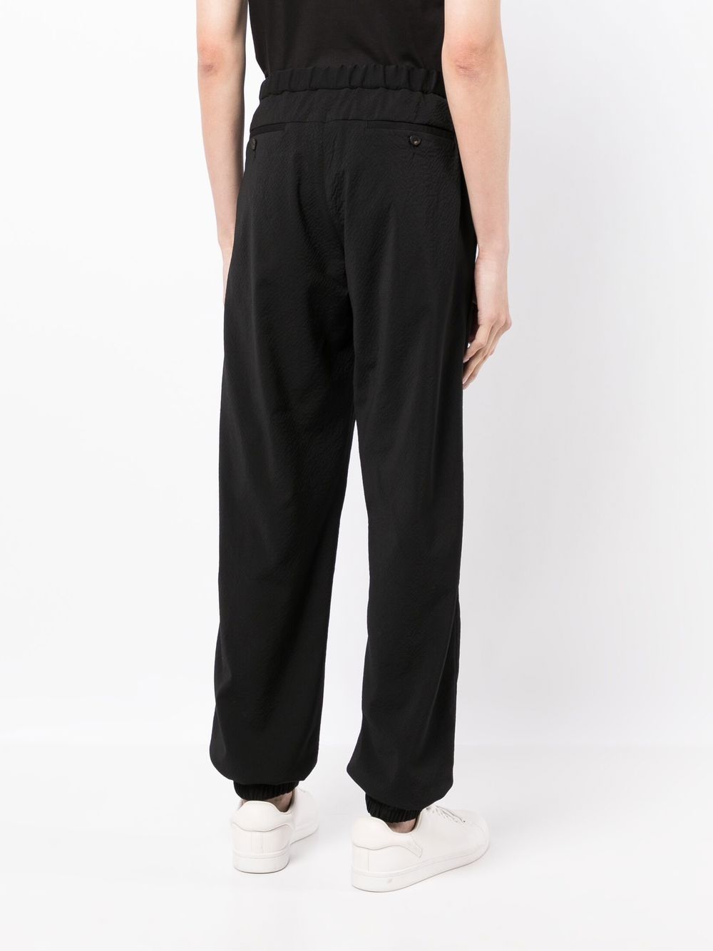 Shop Emporio Armani Cuffed Virgin Wool Trousers In Schwarz