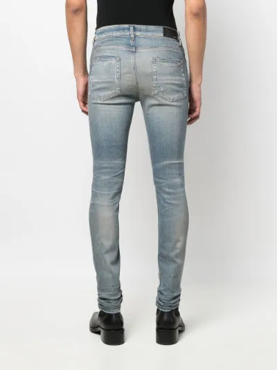 distressed skinny jeans | AMIRI 