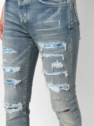 distressed skinny jeans | AMIRI 