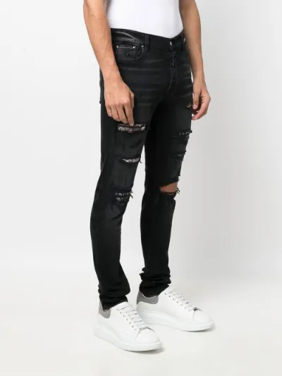 ripped slim-fit jeans | AMIRI | Eraldo.com