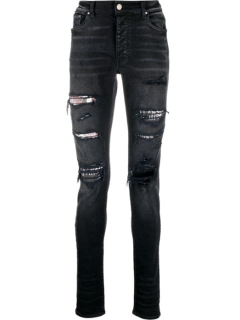AMIRI jeans slim con detalles rasgados