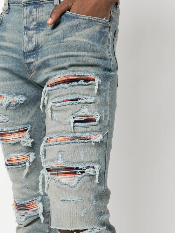 AMIRI Distressed Skinny Jeans | Blue | FARFETCH