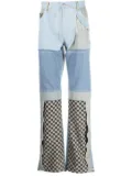 MISBHV upcycled monogram-patchwork jeans - Blue