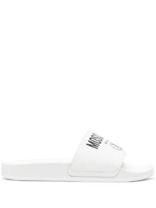 Moschino logo print Slides Farfetch