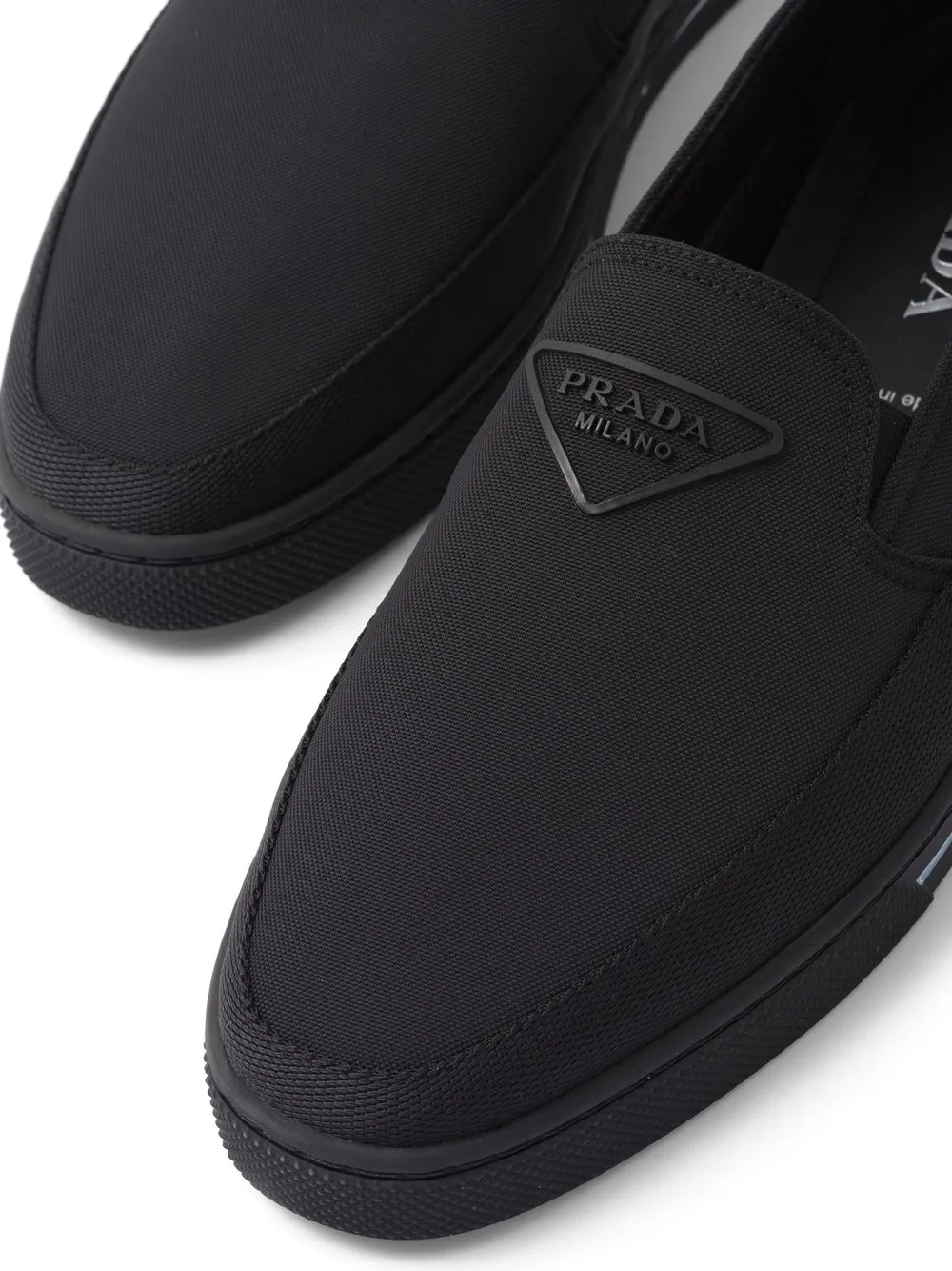 Shop Prada Slip-on Sneakers In Schwarz