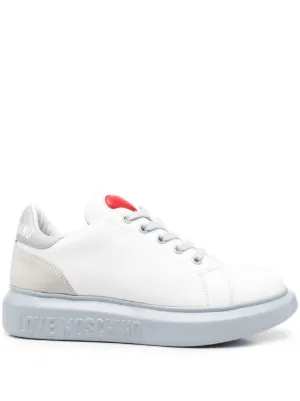white trainers with red back