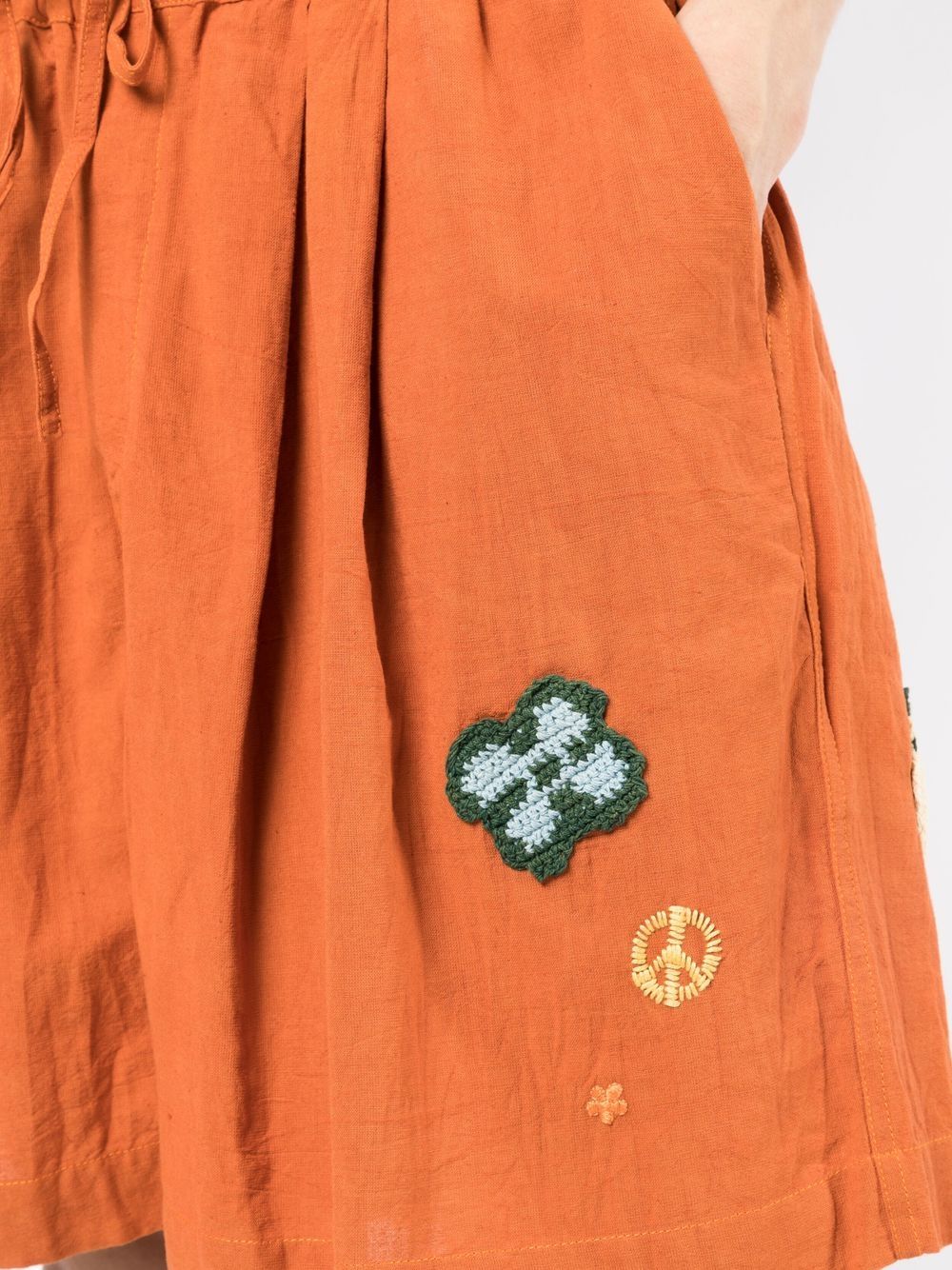 STORY mfg. Bridge appliqué-detail Shorts - Farfetch