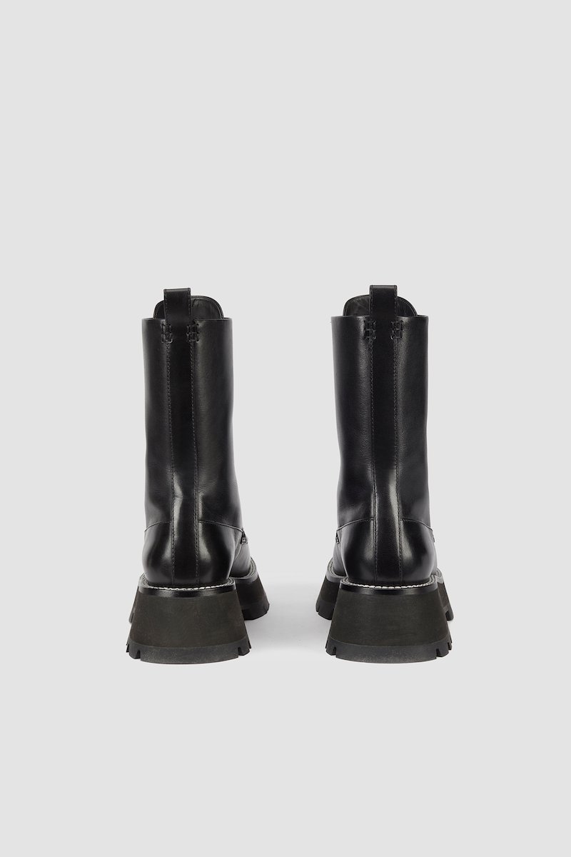 Kate Lace Up Combat Boot, Kate lace-up combat boots from 3.1 PHILLIP LIM featuring black, calf leather, round toe, front lace-up fastening, pull-tab at the heel, contrast stitching and chunky rubber lug sole.- 2