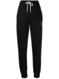 BAPY BY *A BATHING APE® embroidered slogan track pants - Black
