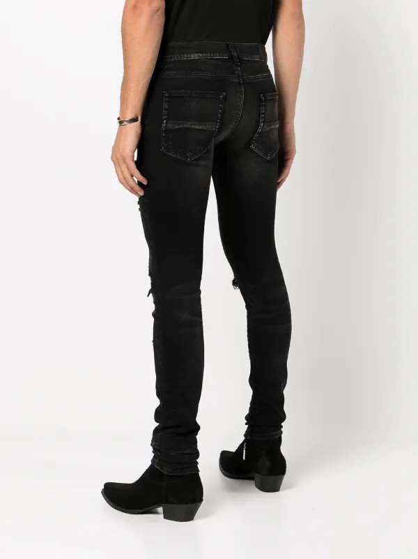 AMIRI Distressed Skinny Jeans | Black | FARFETCH