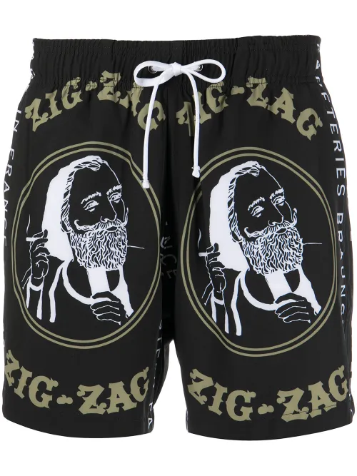 Short de bain à imprimé graphique - AMIRI - Modalova