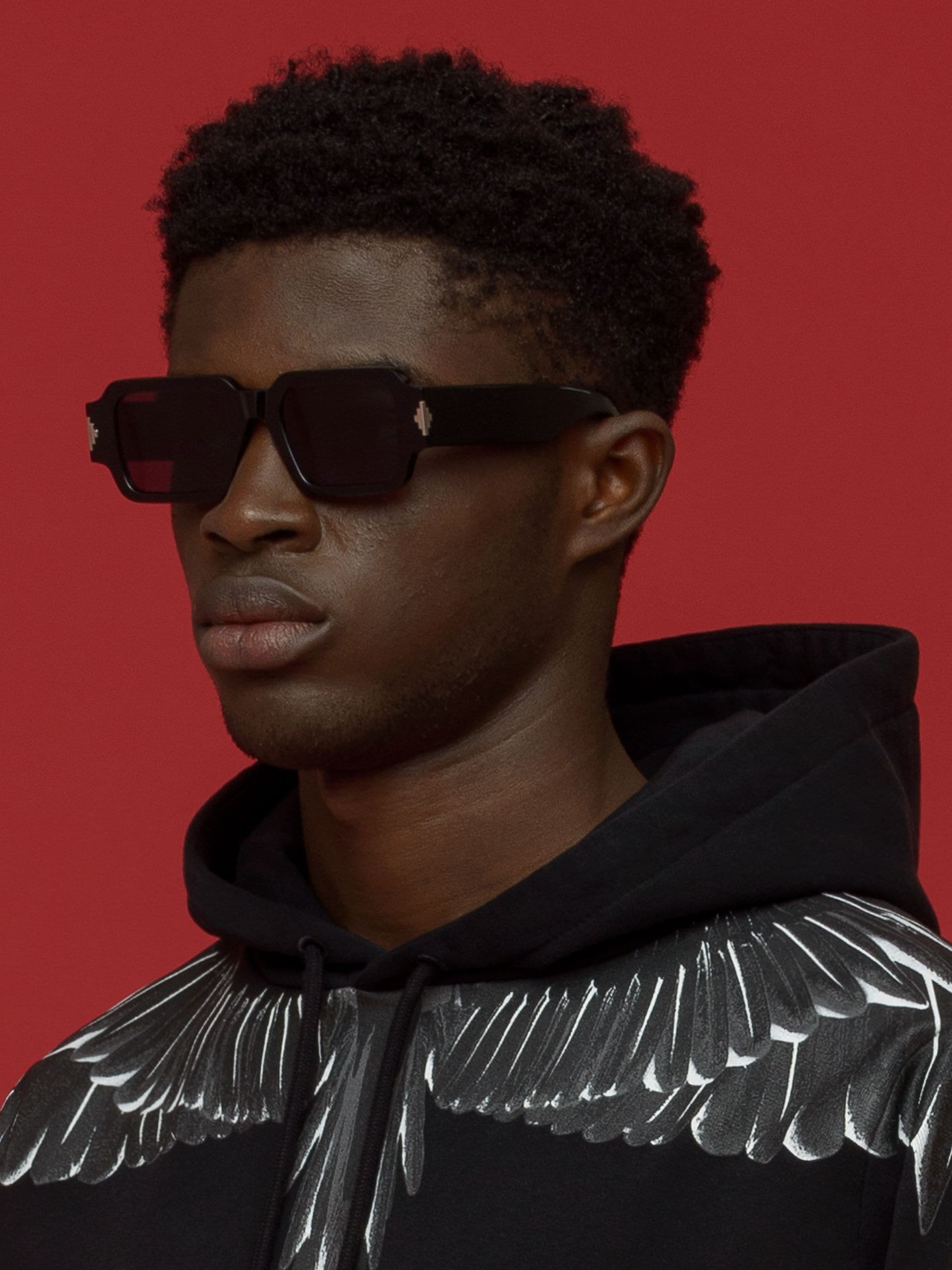 Alerce square-frame sunglasses from Marcelo Burlon County of Milan featuring black, square frame, grey tinted lenses, signature Cross motif and curved arms. These glasses come with a protective case..