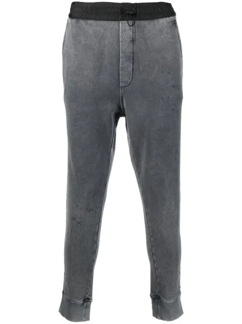 faded distressed track pants