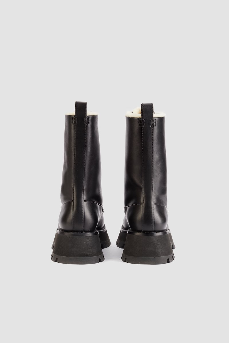 Kate Lace Up Combat Boot With Shearling-black #0 Kate Lace Up Combat Boot With Shearling, lace-up boots from 3.1 PHILLIP LIM featuring black, calf leather, pull-tab at the heel, round toe, front lace-up fastening and chunky rubber sole.- 2