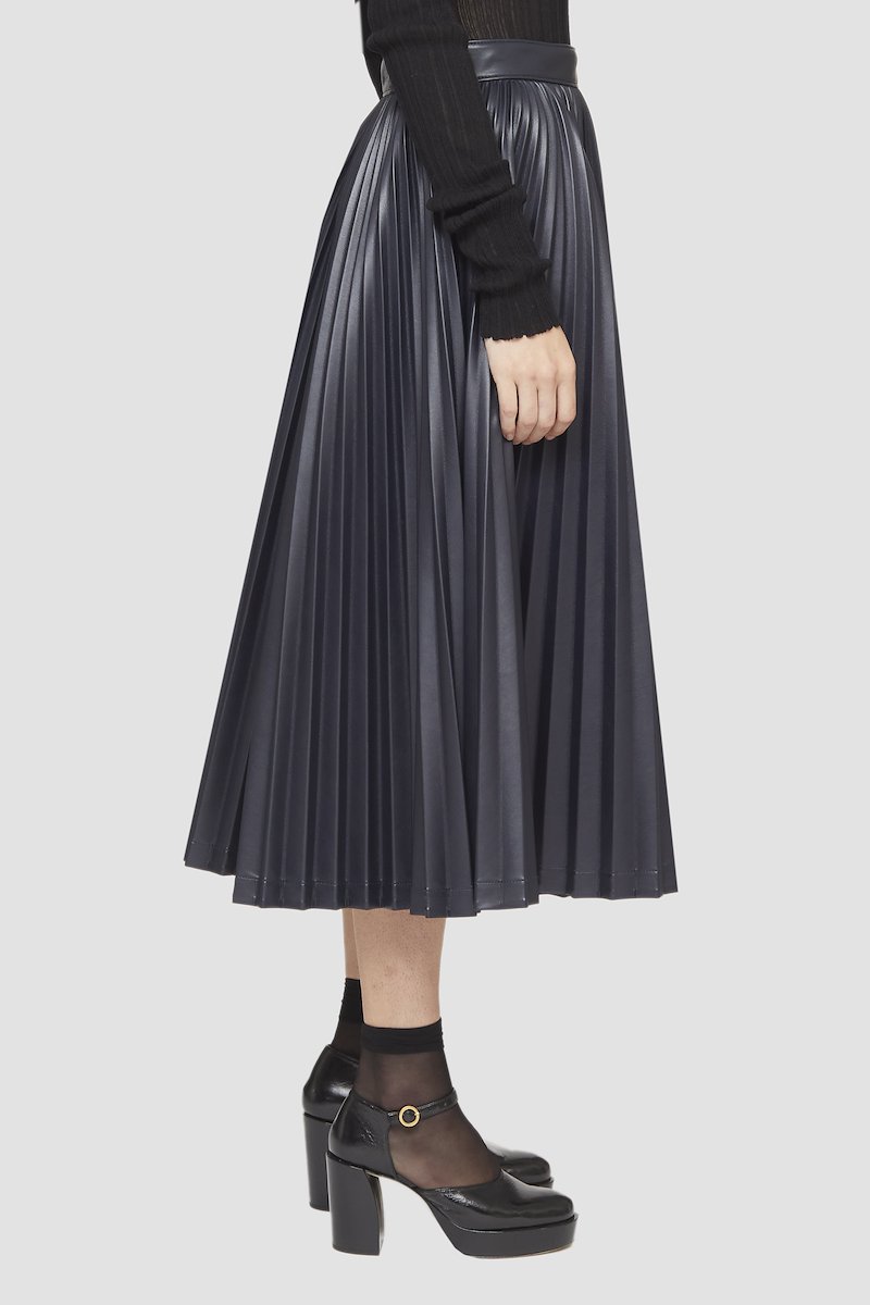 Leather Alternative Asymmetrical Pleated Skirt-ink #0 Leather Alternative Asymmetrical Pleated Skirt, asymmetrical-pleat midi skirt from 3.1 PHILLIP LIM featuring black, faux leather, A-line, fully pleated, asymmetric design, high waist, slip pockets to the sides and mid-length.- 4