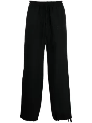 One leg black best sale one leg white sweatpants