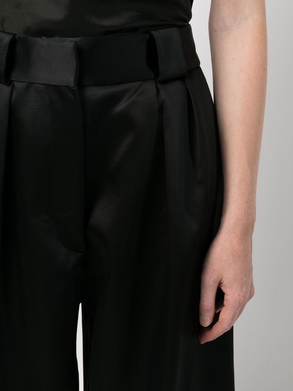 Shop Khaite Satin Pleat-detail Palazzo Trousers In Black