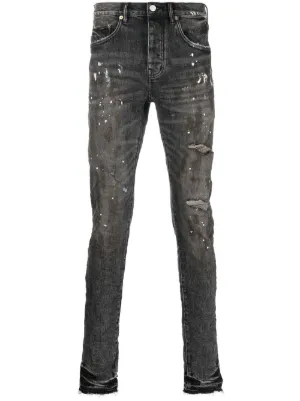 black jeans with blue paint splatter