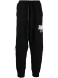 NILøS graphic-print track-pants - Black
