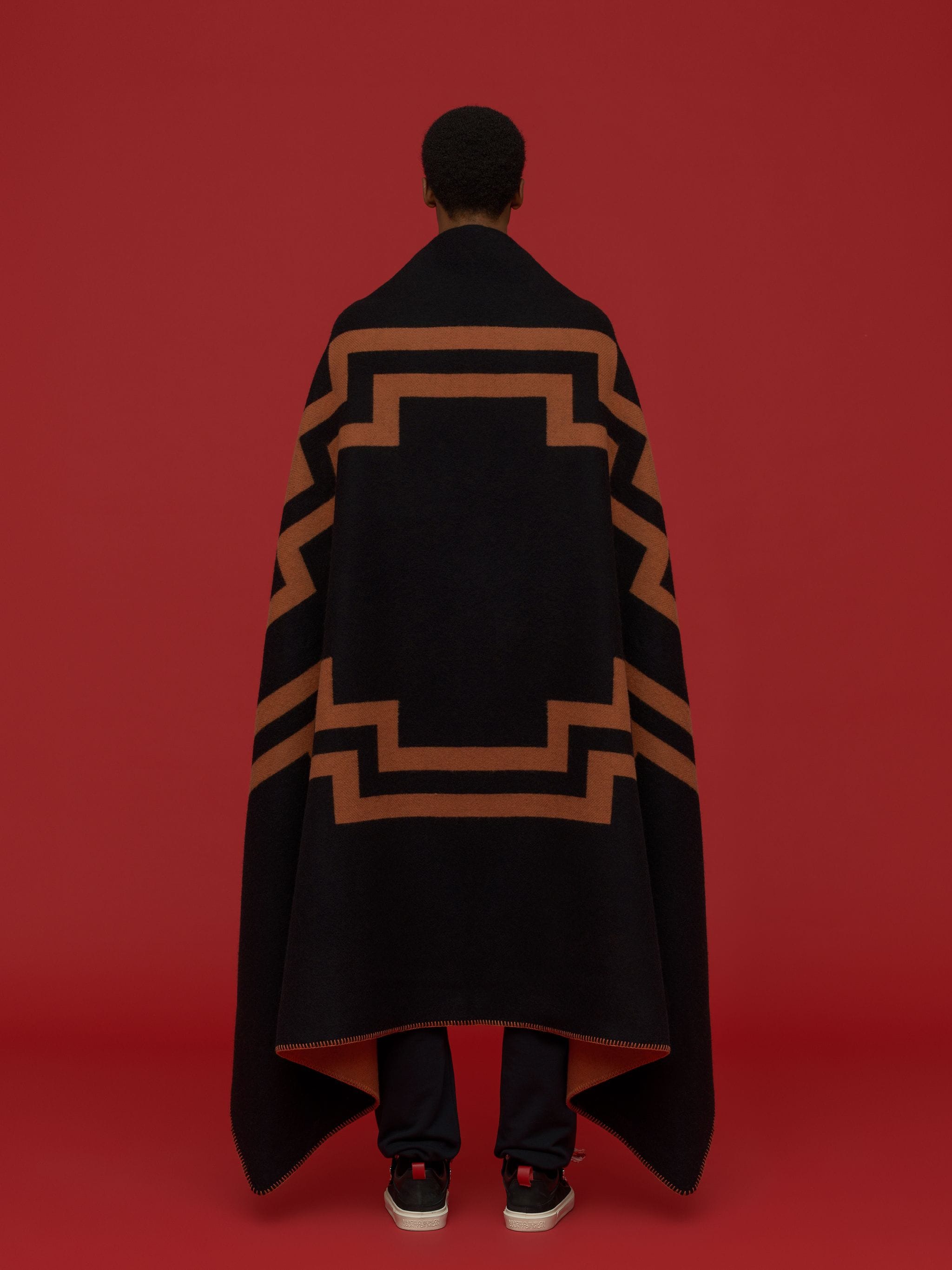 Rural Cross motif soft blanket from Marcelo Burlon County of Milan featuring black, orange, wool, signature Cross motif and logo patch to the side.
