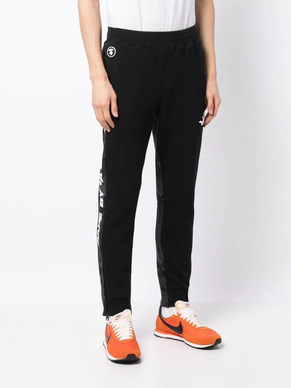 AAPE BY A BATHING APE Logo print Slip on Track Pants Farfetch aape-by-a-bathing-ape-logo-print-slip-on-track-pants-farfetch