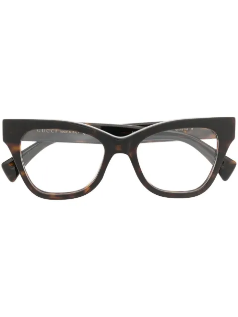 Gucci Eyewear Armação de óculos gatinho efeito tartaruga
