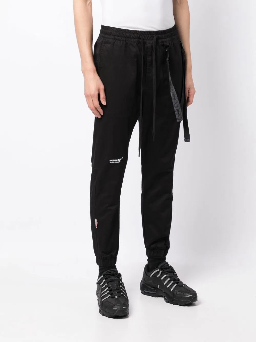musium-div-logo-print-tapered-trousers-farfetch
