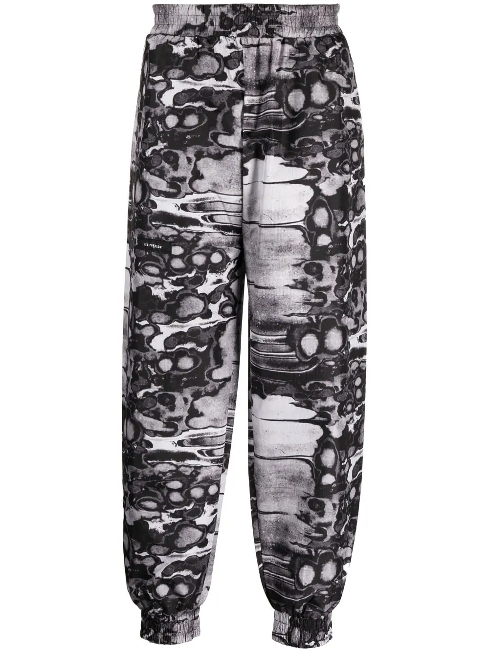 Khumbu abstract-print track pants