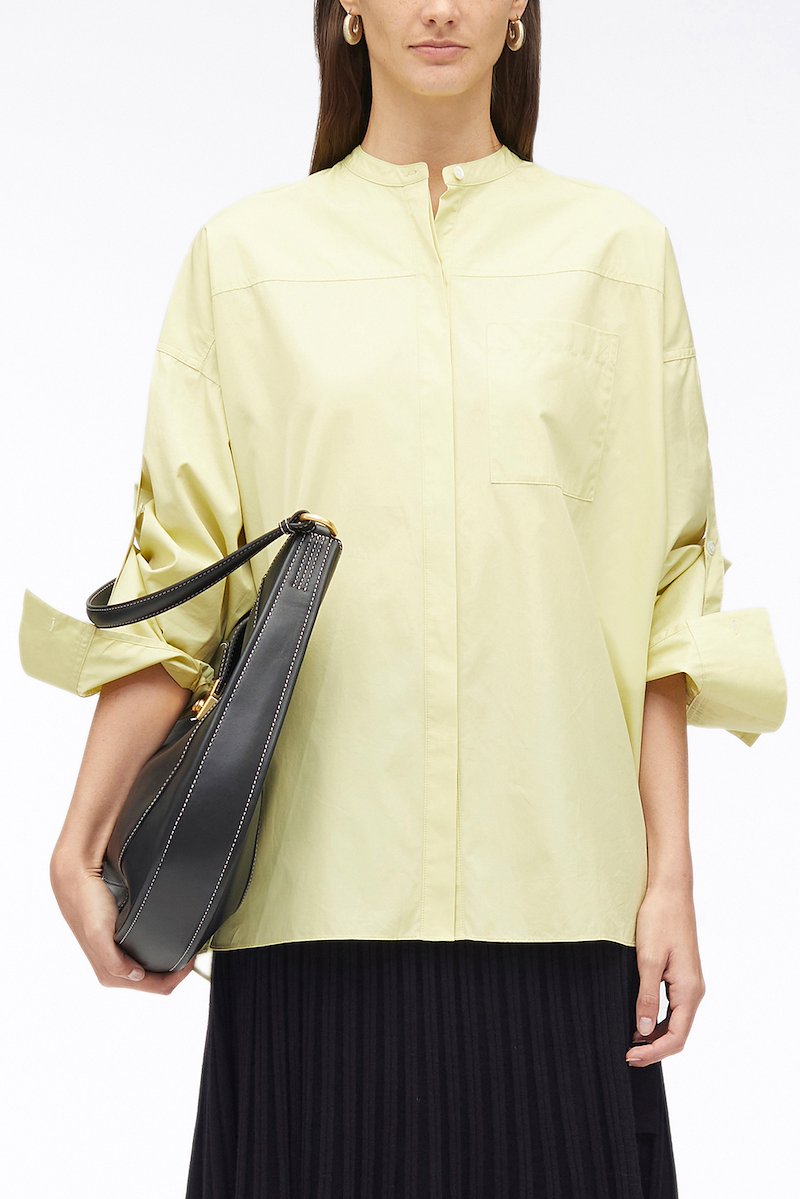 Long Sleeve Classic Poplin Shirt, cotton long-sleeved shirt from 3.1 PHILLIP LIM featuring light yellow, cotton, chest patch pocket, band collar, concealed front fastening, drop shoulder, long sleeves, tie sleeves and side slits.- 1