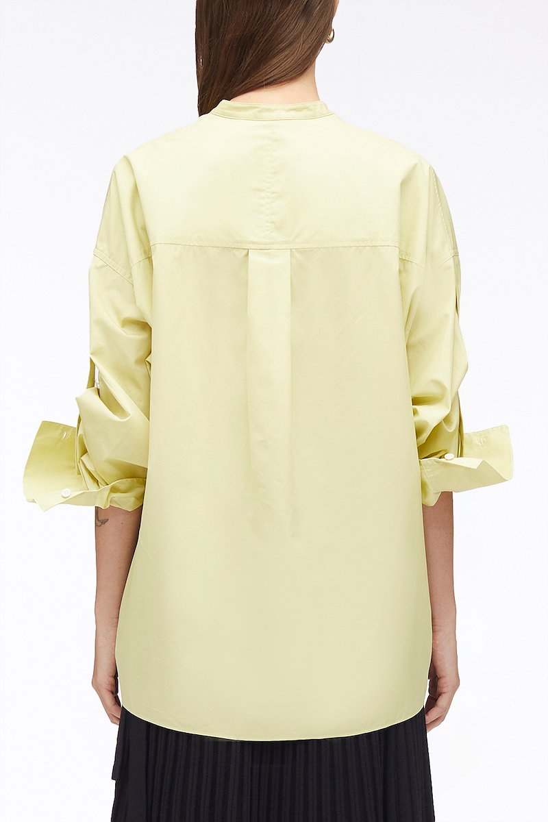 Long Sleeve Classic Poplin Shirt-yellow #1 Long Sleeve Classic Poplin Shirt, cotton long-sleeved shirt from 3.1 PHILLIP LIM featuring light yellow, cotton, chest patch pocket, band collar, concealed front fastening, drop shoulder, long sleeves, tie sleeves and side slits.- 3