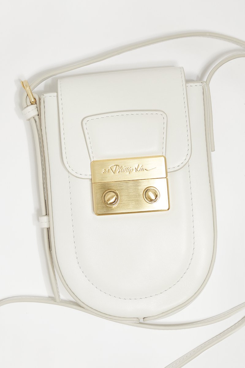 Pashli Kit Crossbody-white #1 Pashli Kit Crossbody, Pashli leather crossbody bag from 3.1 PHILLIP LIM featuring white, calf leather, engraved logo, gold-tone hardware, single shoulder strap, foldover top, push-lock fastening and main compartment.- 3