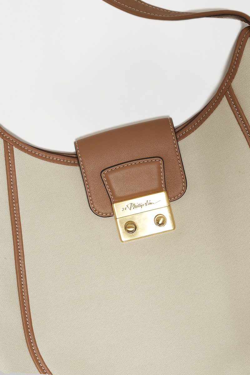 Pashli Large Modern Hobo-neutrals #1 Pashli Large Modern Hobo, Pashli Large Modern Hobo bag from 3.1 PHILLIP LIM featuring ecru, brown, cotton, calf leather, canvas, leather trim, contrast stitching, engraved logo, gold-tone hardware, push-lock fastening, curve-edge body, main compartment and internal zip-fastening pocket.- 3
